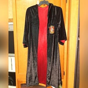 A Harry Potter hooded robe with a Gryffindor badge on the front. OSFM